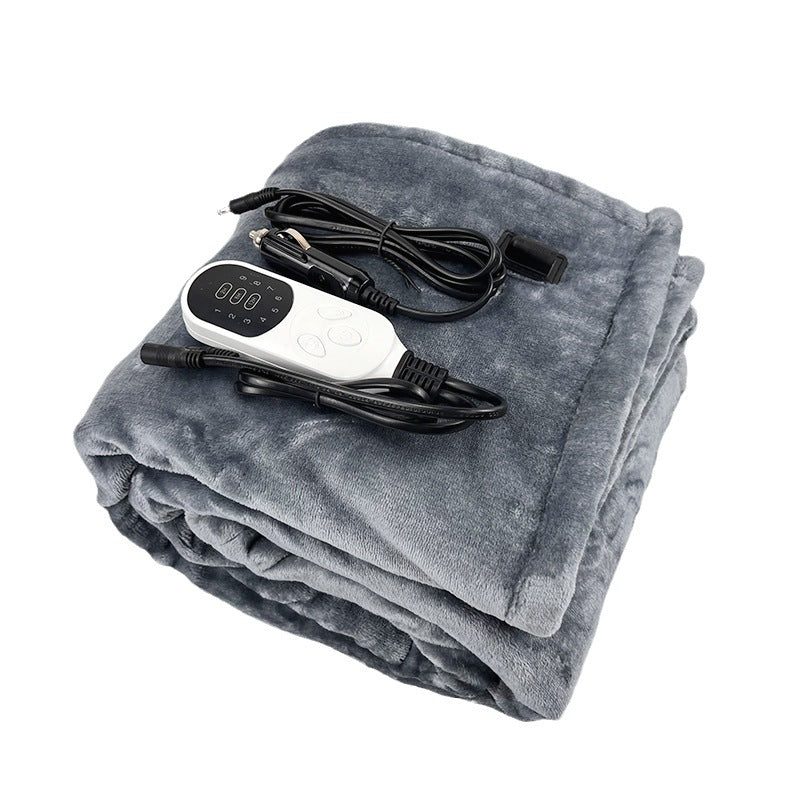 Folded grey electric heated blanket with digital temperature control remote and power cord.