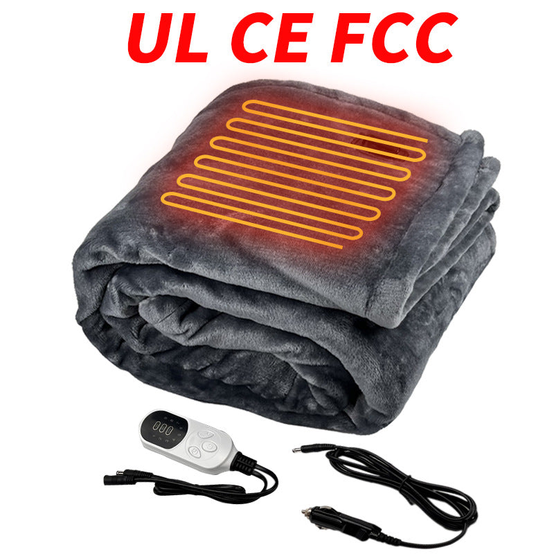 Folded grey electric heated blanket with a remote control and car power adapter
