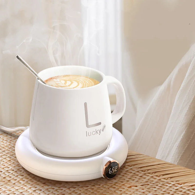 Smart mug warmer with digital temp display heating coffee in white ceramic mug, cozy home setting