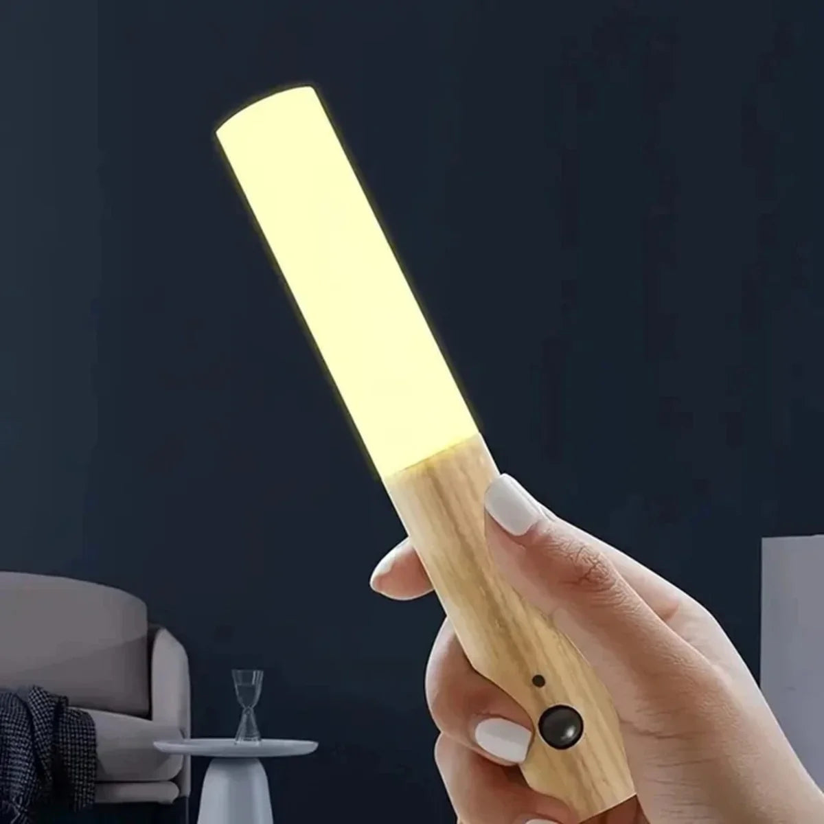 Wooden handheld LED lamp with warm glow, modern minimalist design for home lighting