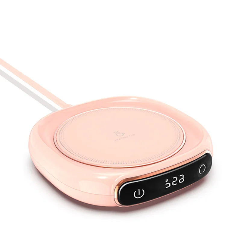 Pink smart mug warmer with digital temperature display and power button, ideal for keeping drinks warm.